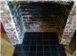Glenn Reed Tiling Services-fire place in black quarry tiles in coolham